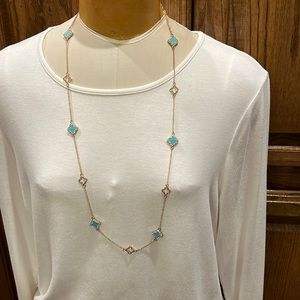 NWOT Gold necklace with turquoise stones and clear rhinestones.